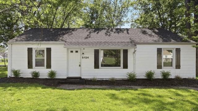 White ranch house with black shutters bought by TruOffer