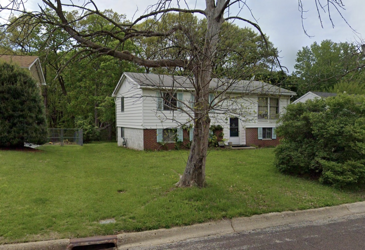 White split-level house with a brick lower level bought by TruOffer