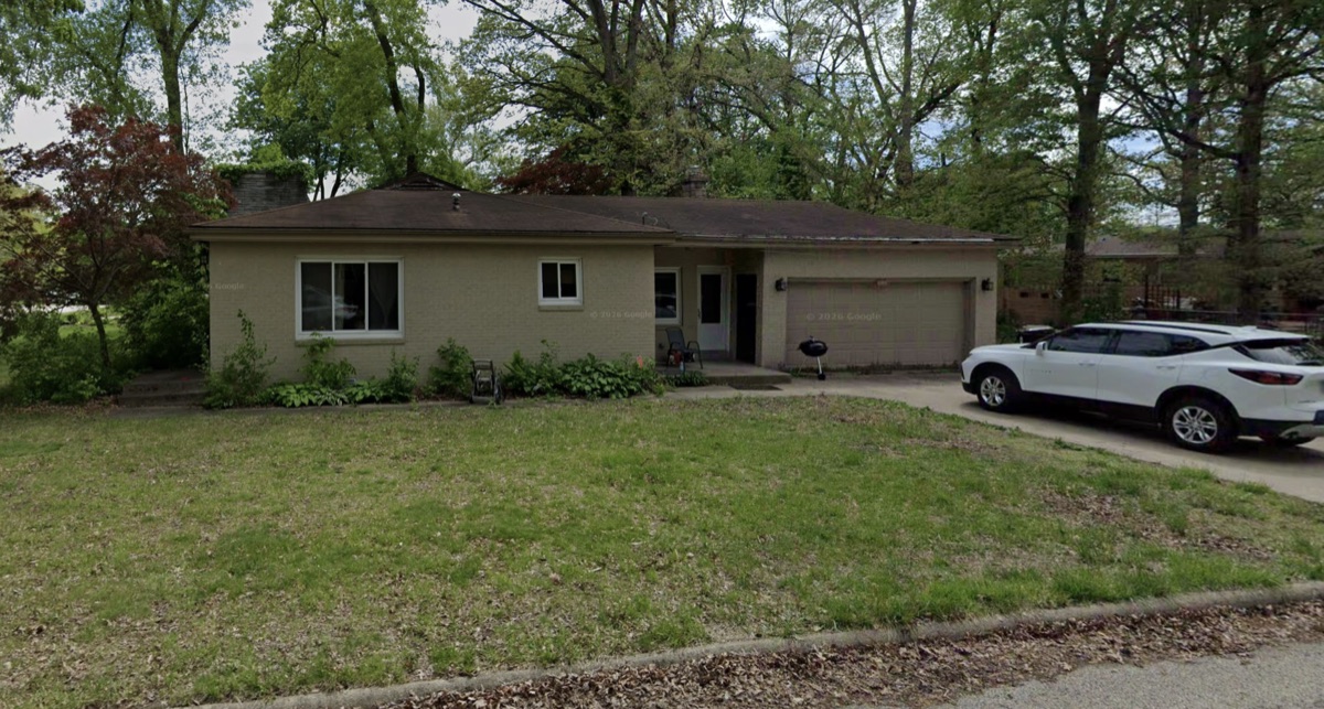 Light brick ranch house with an attached garage bought by TruOffer